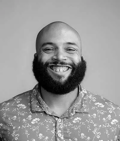 A smiling man with a beard wearing a floral shirt, representing Crown Marketing, a Las Vegas digital marketing agency known for SEO Las Vegas and website design services.| Crown Marketing Digital Marketing Agency Las Vegas
