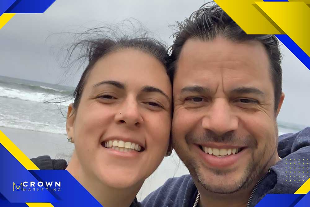 A smiling couple at the beach with a Crown Marketing logo, highlighting their Las Vegas marketing expertise.| Crown Marketing Digital Marketing Agency Las Vegas