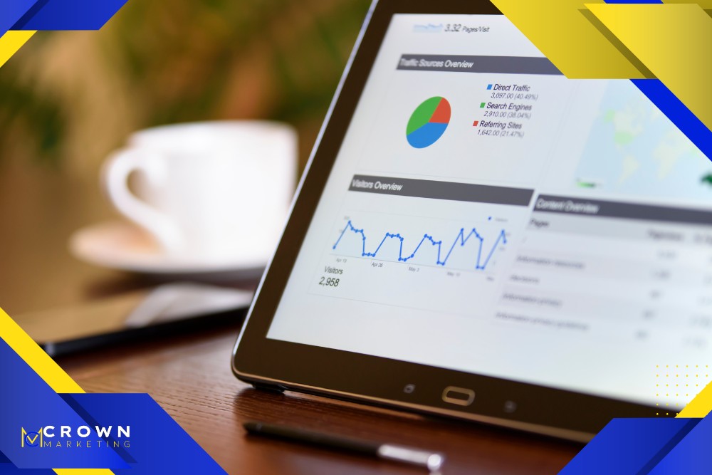 A tablet displaying analytics charts on a wooden table with a blurred coffee cup in the background, showcasing Crown Marketing's digital marketing services.| Crown Marketing Digital Marketing Agency Las Vegas