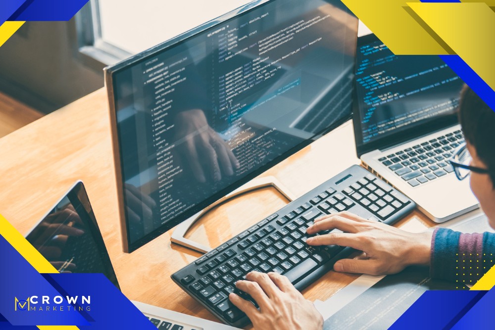 A person works on a computer with code on the screen, representing Crown Marketing's digital marketing services in web design and SEO Las Vegas.| Crown Marketing Digital Marketing Agency Las Vegas