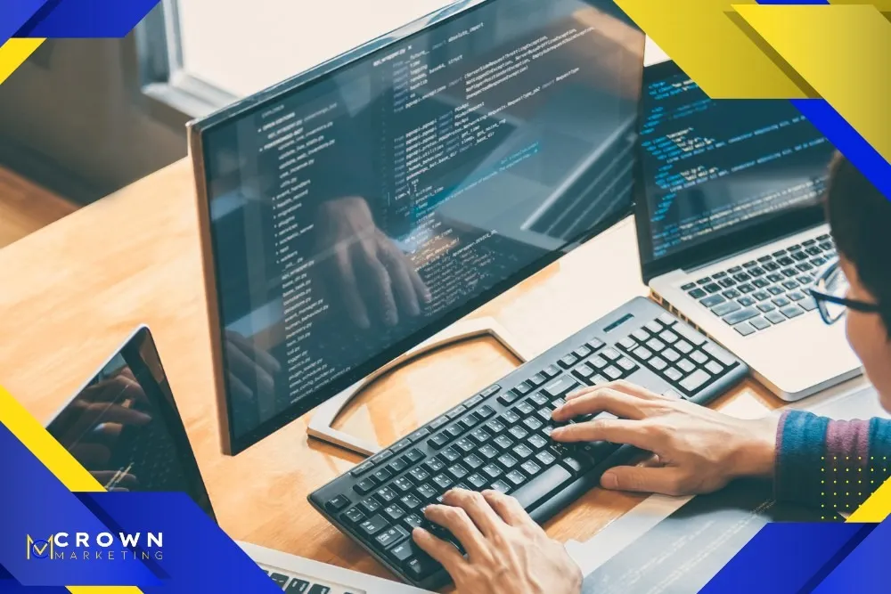 A person works on a computer with code on the screen, representing Crown Marketing's digital marketing services in web design and SEO Las Vegas.| Crown Marketing Digital Marketing Agency Las Vegas
